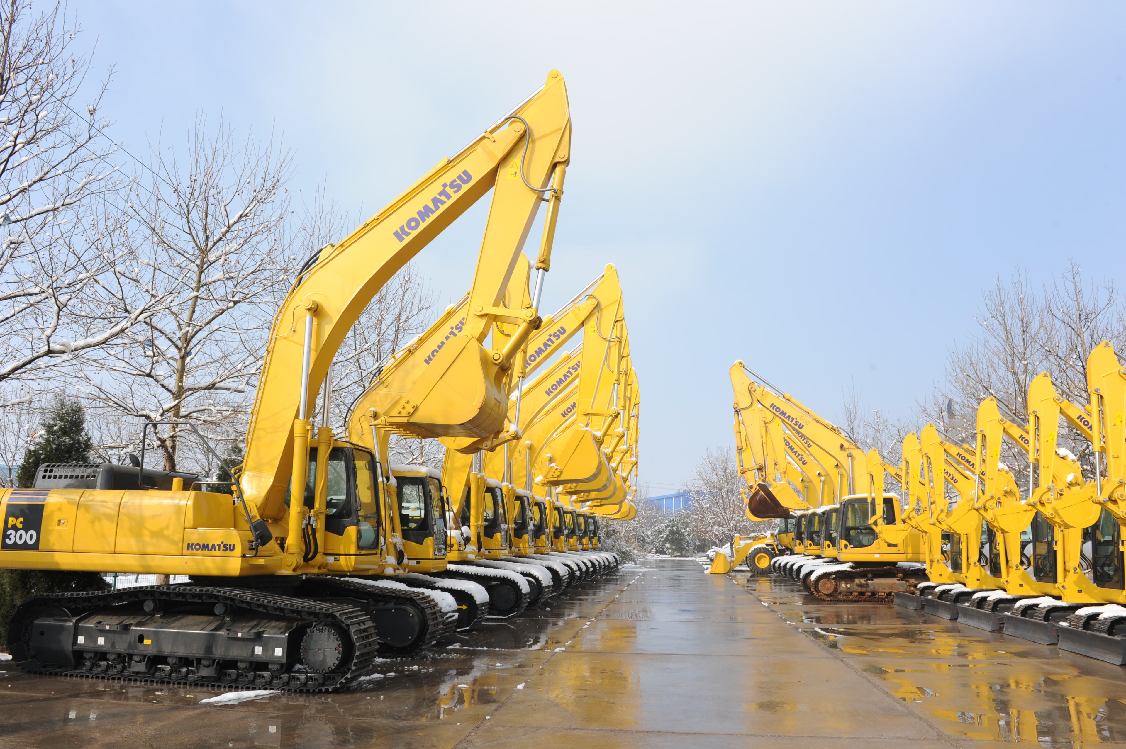 Rows of yellow construction equipment at Beijing Hengri Industrial Park